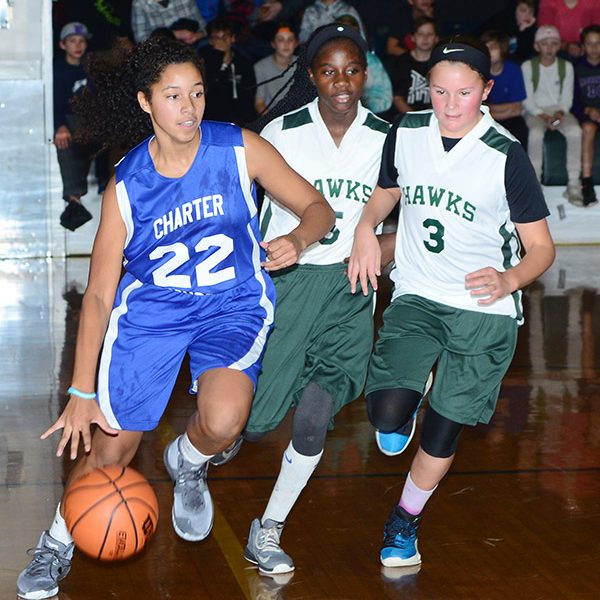 Josie Chivers is off on the fast break with Wadee Hall and Josie Welch fast on her heels.